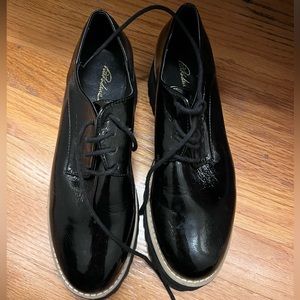 Patent lace ups